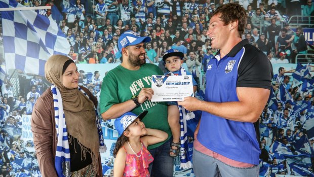 Bulldogs player Josh Jackson with Omar Sabouni, his wife Hanadi and children Reanna, 4, and Mohamed, 2, from Liverpool. The family was presented with a family club membership for 2016.