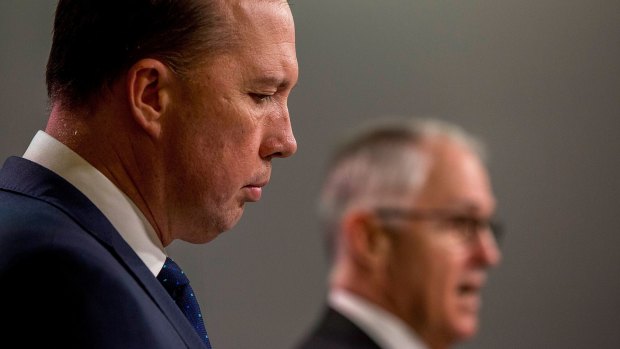 Immigration Minister Peter Dutton (foreground) and Prime Minister Malcolm Turnbull (background).