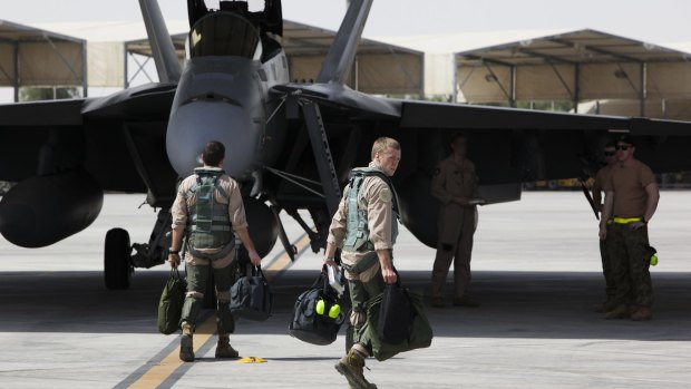 A Royal Australian Air Force F/A-18F Super Hornet crew prepares for departure on another mission in the Middle East. 