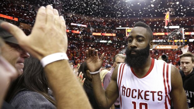 Celebration time: Rockets guard James Harden walks off after the Rockets defeated the Los Angeles Clippers 113-100 in Game 7 of the Western Conference semifinals in Houston. 