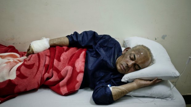 Hany Georgie Salamah, a victim of the St George's Church suicide bombing attack, rests in a hospital bed at the American Hospital in the Nile Delta town of Tanta, Egypt.