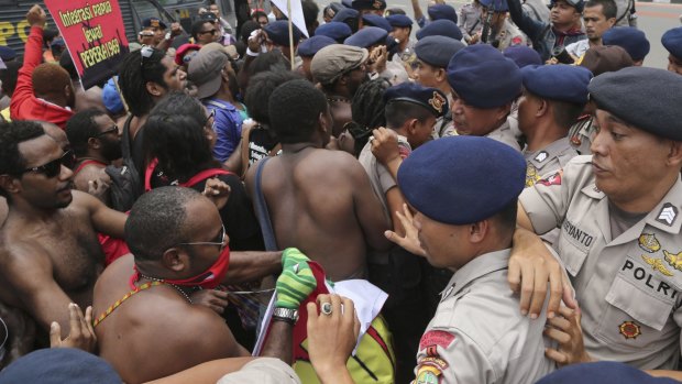 Unresolved conflict: Papuan activists scuffle with police during a rally marking the 53rd anniversary of the Free Papua Movement in Jakarta on December 1.