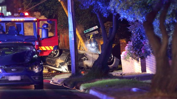 A vehicle on its roof after it clipped another car during a street race.