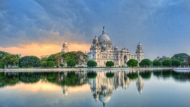The Victoria Memorial in Kolkata at dusk. The Incredible India River Cruise includes a tour of the bustling Indian city.