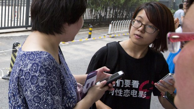 Rights' activist Wei Tingting outside a court where the first case in China involving so-called conversion therapy was held last year. 