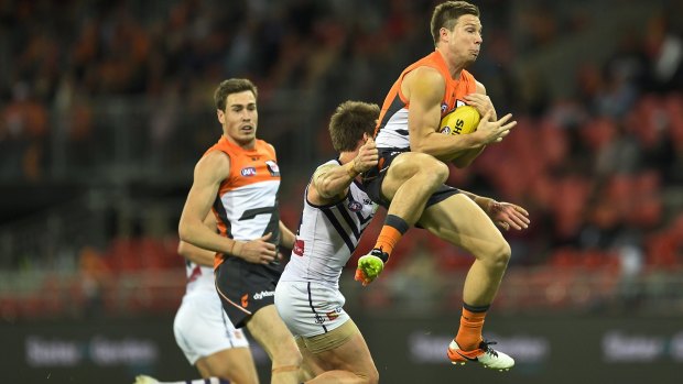 Toby Greene takes a mark against the Dockers.