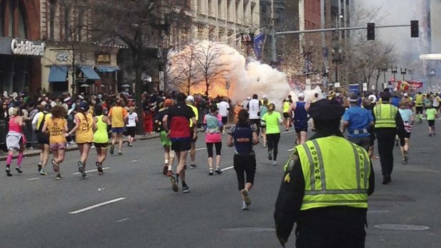 Runners head towards the finish line of the Boston Marathon as the bombs went off on April 15, 2013, killing three people and injuring more than 260 others.