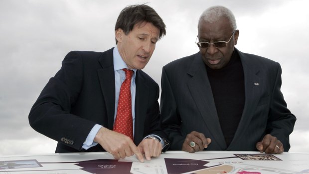 In this May, 2009 file photo current president of the IAAF Sebastian Coe, left, with then president of the IAAF Lamine Diack look at a map of the site of the London 2012 Olympics in London. 