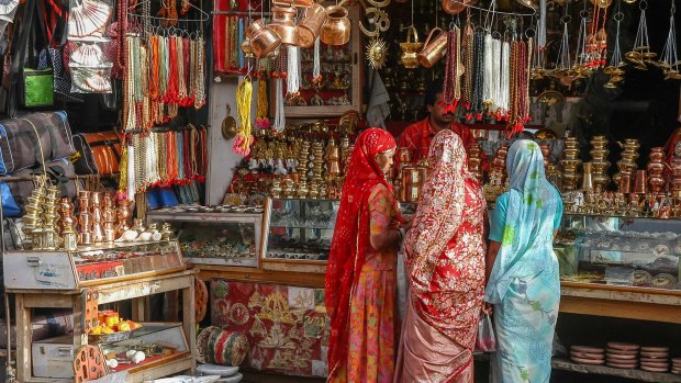 The streets of the holy city of Pushkar are filled with colourful scenes, such as these women out shopping.
