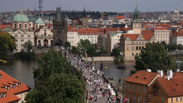 People cross Prague's Charles Bridge in Czechia last week.