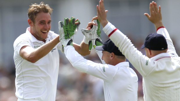 England's Stuart Broad celebrates after taking the wicket of Australia's Mitchell Johnson.