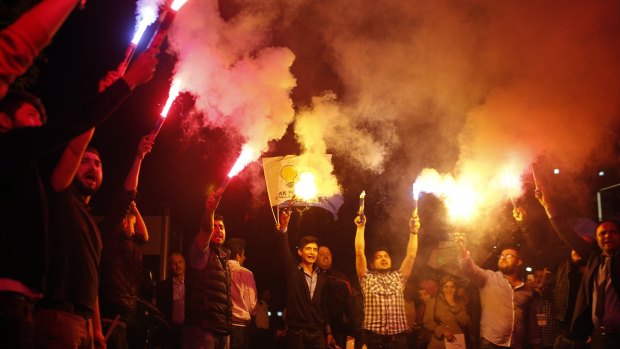 Supporters of Turkey's ruling Justice and Development Party celebrate on Sunday.