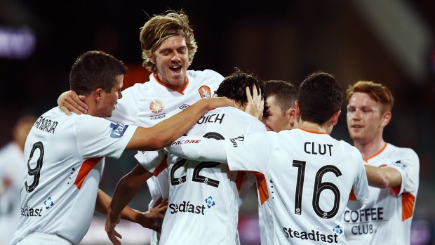 Thomas Broich is congratulated by teammates after getting the equaliser for Brisbane.