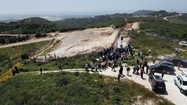 Journalists gather at a border point in south Lebanon last week, during a media trip organised by Hezbollah to show the defensive measures established by Israel to prevent against Hezbollah infiltration.