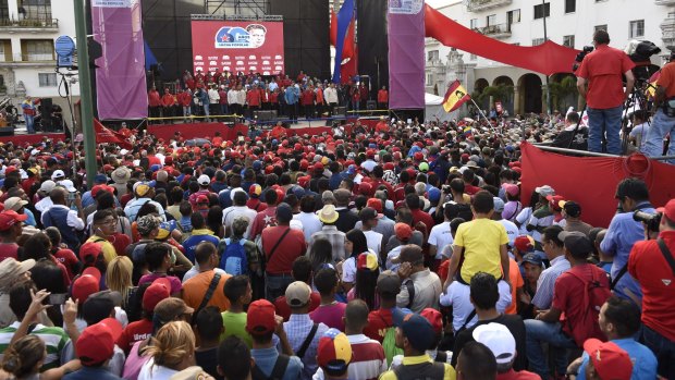Supporters attend a rally with President Nicolas Maduro in Caracas on Tuesday.