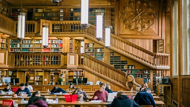 Students studying inside the library of the university of Leuven, Belgium.