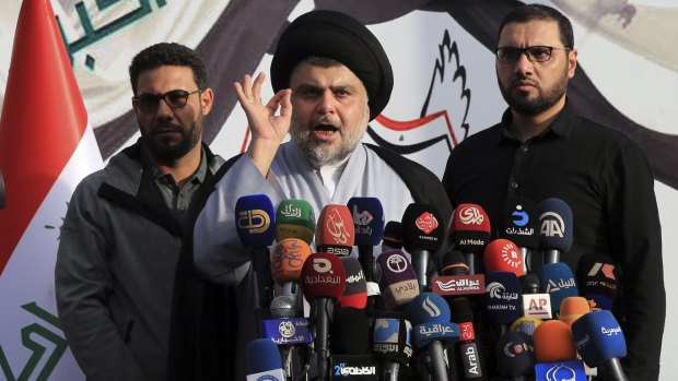 Muqtada al-Sadr speaks to his supporters and regional and international media before entering the Green Zone on March 27. 