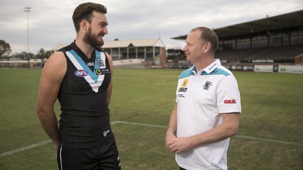 Charlie Dixon with Port Adelaide coach Ken Hinkley at Alberton Oval last year.