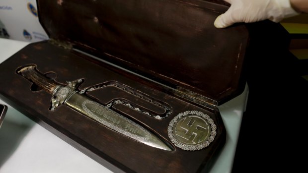 A knife with Nazi markings is seen at the Interpol headquarters in Buenos Aires, Argentina.