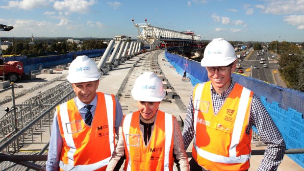 NSW Transport Minister Andrew Constance, Premier Gladys Berejiklian and project director of Sydney Metro NorthWest, Rodd Staples, at the construction site at Windsor Road, Rouse Hill.