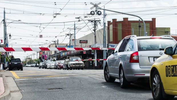 Waiting, waiting: the level crossing at Glenhuntly Station causes angst among motorists.