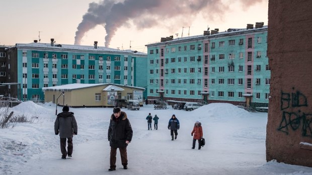 People on the streets in Dudinka, Russia, a small port city on the Yenisei River and the main transportation hub for the palladium, nickel, copper and other metals produced in nearby Norilsk.