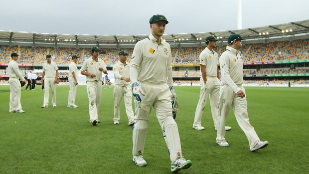 Rain, rain go away: The Australian team leave the field as weather delays play on day four.