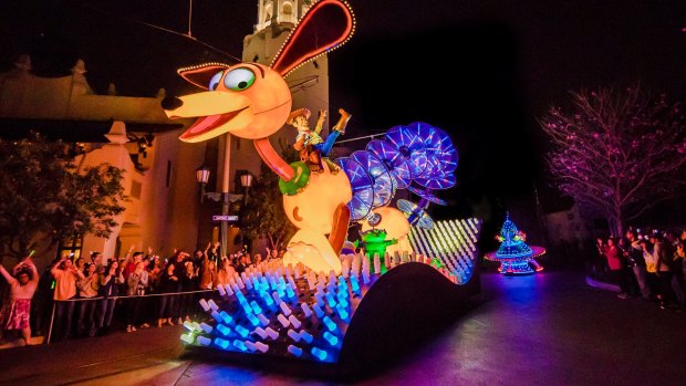 Slinky Dog and Woody from Toy Story in the Paint the Night parade.