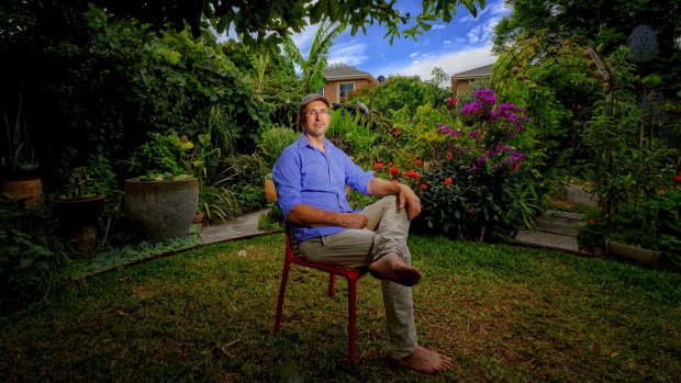 David Elliot in the only open part of his abundant Footscray garden.
