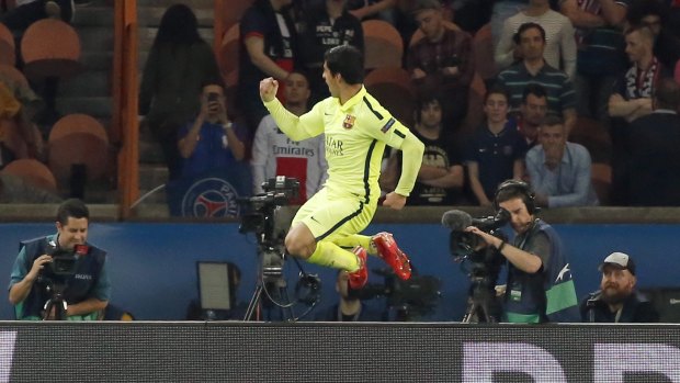 Suarez celebrates his side's third goal.