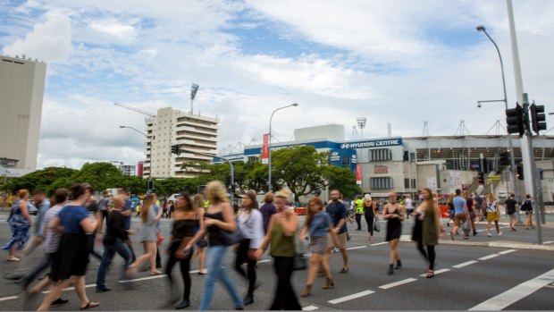 Adele fans cross the road to the Gabba on March 4.