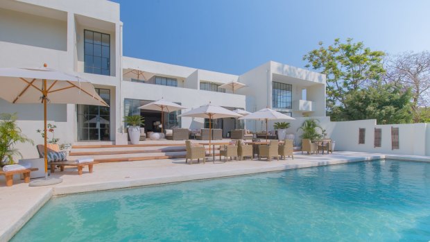 Dining spaces flow across several rooms centred on the sleek bar and spill out onto the poolside terrace.