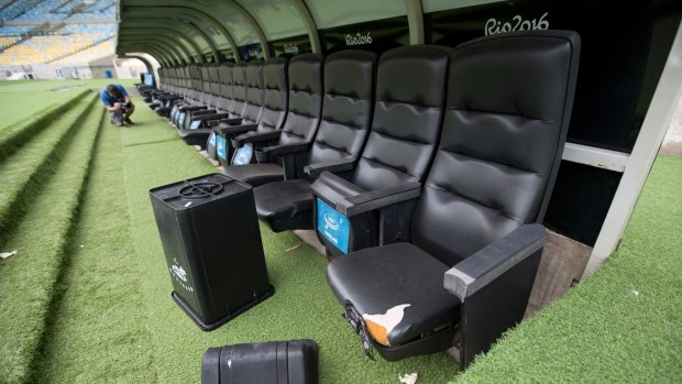 A rubbish bin and ripped seats at one of the dugouts in Rio's world-famous Maracana stadium.