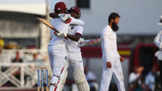 Series squared: Jermaine Blackwood (R) and Denesh Ramdin (L)  of West Indies celebrate the home side's win.
