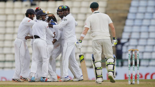 Sri Lanka celebrates the dismissal of Australia's Steve Smith on day five.