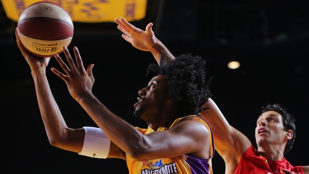 Driving to the bucket: Josh Childress scores against Wollongong in his first NBL match.
