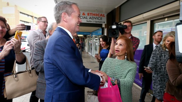 Esther Arador sings <i>Unchained Melody</i> to Opposition Leader Bill Shorten during a street walk in Campbelltown, NSW. 