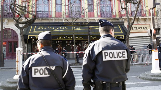 Police officers patrol outside the Bataclan concert hall in Paris after the November 13 attacks.