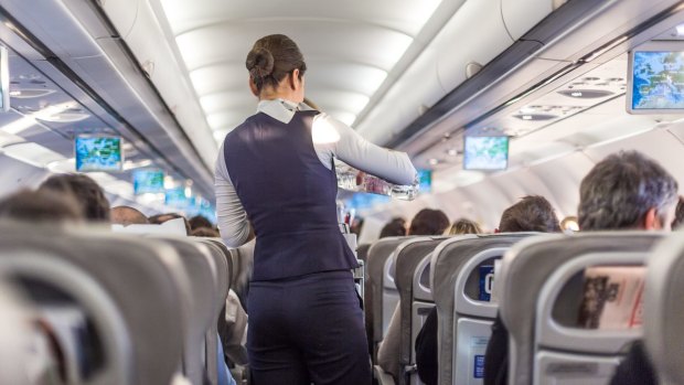Flight attendants serve you food and drinks on a flight, but should you tip them in the US?