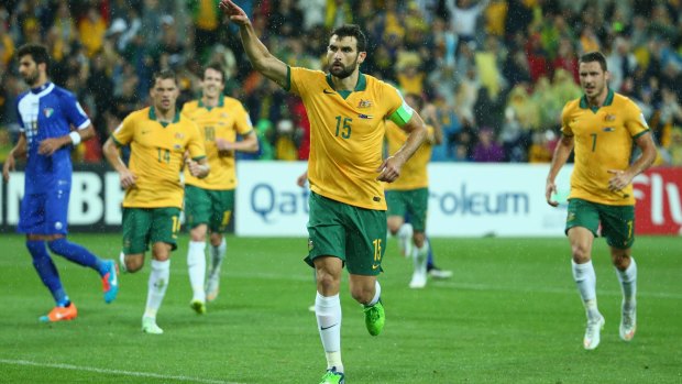 Socceroos captain Mile Jedinak celebrates after converting a penalty.