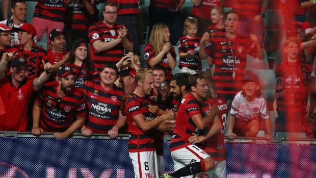Striking out: Mitch Nichols celebrates with his team after scoring during the round nine A-League match between the Western Sydney Wanderers and the Brisbane Roar at Pirtek Stadium.