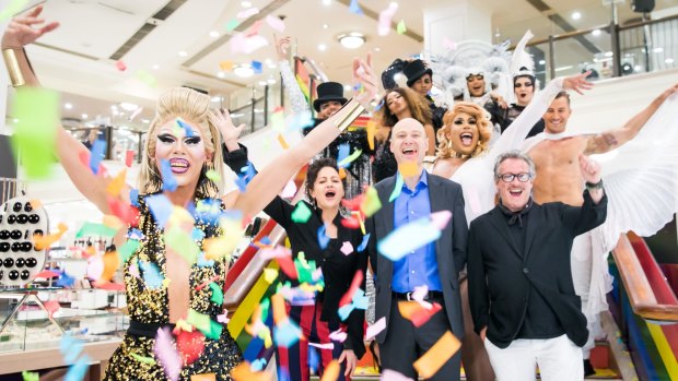 (L-R on the stairs) Sydney Gay and Lesbian Mardi Gras CEO Terese Casu, Myer CEO Richard Umbers and Myer designer and marriage equality advocate Jayson Brunsdon, surrounded by performers at the announcement of Myer's three year partnership with Mardi Gras.