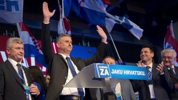 Croatia's Opposition leader Tomislav Karamarko, second from left, celebrates his coalition's victory in Zagreb on Monday. 