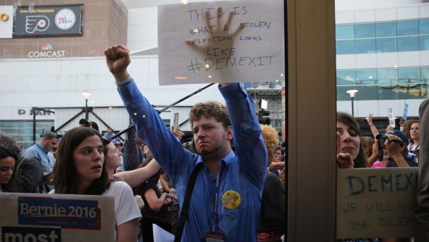 Supporters of  Bernie Sanders protest during the Democratic National Convention in Philadelphia. Stolen emails were re-posted through social media to divide the public.