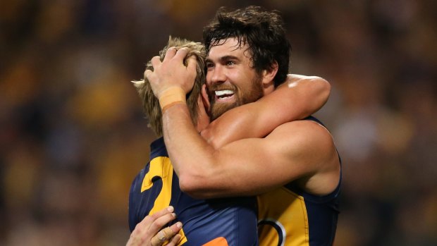 Josh Kennedy and Mark LeCras enjoy that winning feeling on Saturday after defeating North Melbourne.