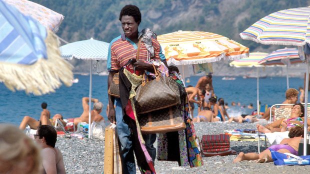 A street vendor on the beach of Riva Trigoso in Liguria, Italy.