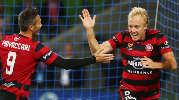 Mitch Nichols of the Wanderers (right) celebrates a goal with Frederico Piovaccari.