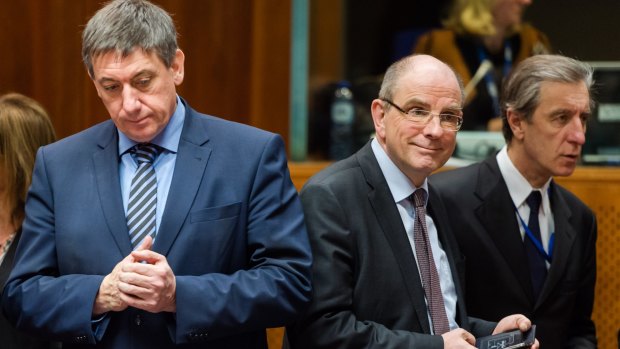 Belgian Interior Minister Jan Jambon, left, and Justice Minister Koen Geens, centre, arrive for an extraordinary meeting at the EU Council building in Brussels on Thursday.