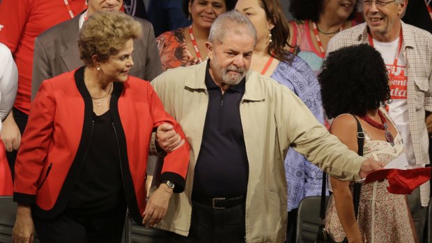 Former Brazilian president Luiz Inacio Lula da Silva, right, and current President Dilma Rousseff attend the Central Workers Union convention in Sao Paulo on Tuesday.