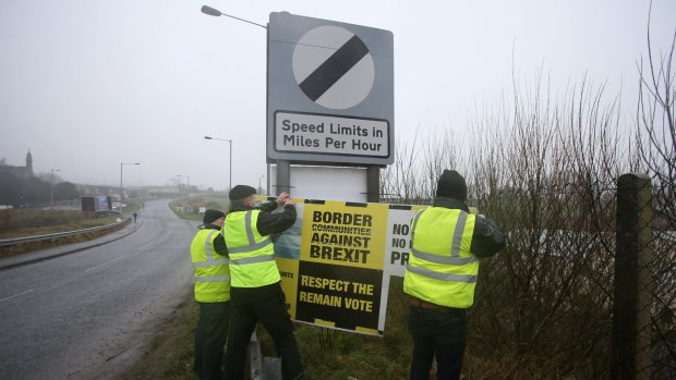 Anti-Brexit campaigners earlier this year put up signs before holding a go-slow protest on the main road between Northern Ireland and the Republic of Ireland to highlight concerns about the impact on trade.